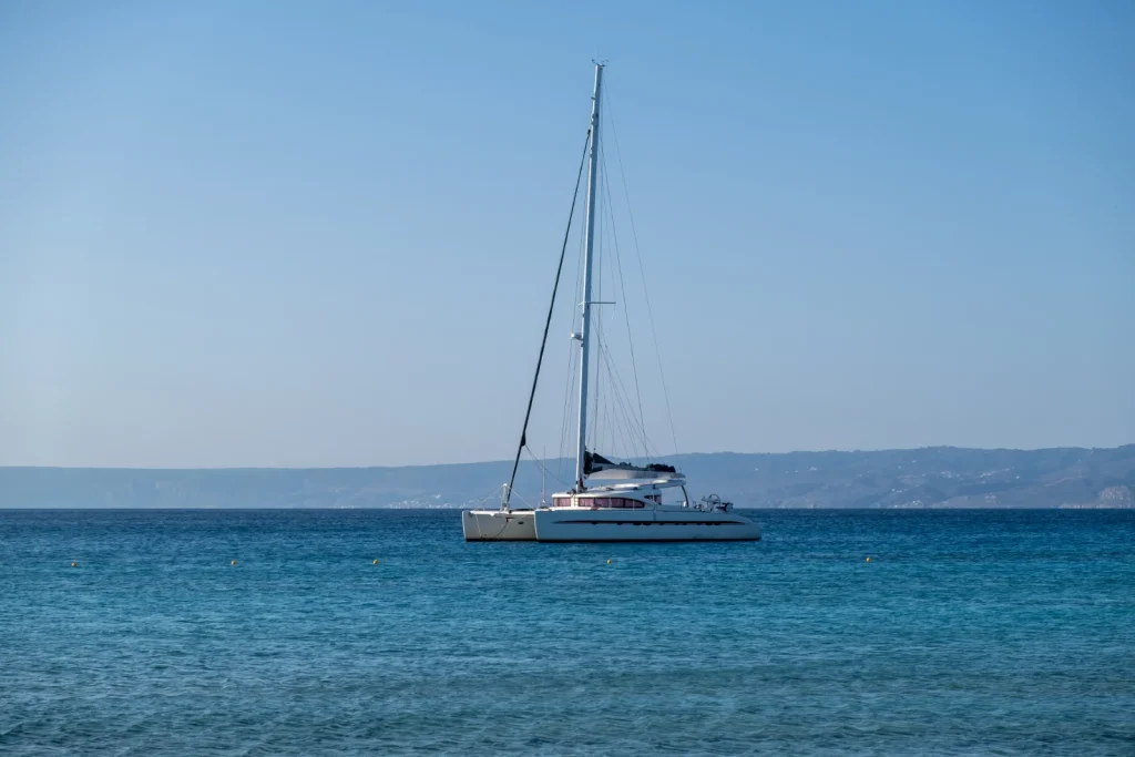 sailing boat catamaran anchored at rippled sea la 2024 12 07 22 07 06 utc